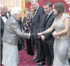  ??  ?? The Queen chats to Brendan Rodgers and Mischa last night