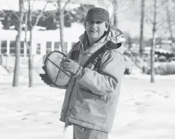  ?? MITSUKI MORI/THE GUARDIAN ?? Carl Phillis, a pottery, ceramic and welding artist, has been playing frisbee for about 40 years. He even enjoys getting out this time of year to throw the flying disc in the snow in the field by Founders’ Hall in Charlottet­own. “Summer time is much better for frisbee,” he smiles.