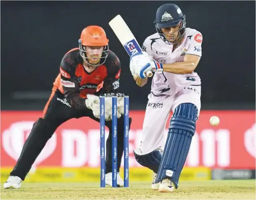  ?? Agence France-presse ?? ↑
Gujarat Titans’ Shubman Gill (right) plays a shot during their IPL match against Sunrisers Hyderabad in Ahmedabad on Monday.