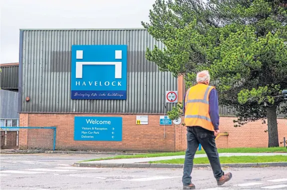  ?? Pictures: Steve MacDougall/Wullie Marr. ?? An employee leaves after the meeting this week where staff were told they had lost their jobs.
