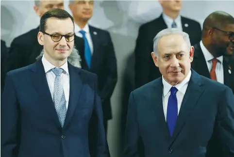  ?? (Kacper Pempel/Reuters) ?? THEN-PRIME MINISTER Benjamin Netanyahu and Polish Prime Minister Mateusz Morawiecki at a Middle East summit in Warsaw in 2019.