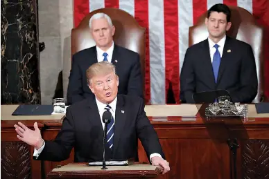  ?? AP Photo/Pablo Martinez Monsivais ?? President Donald Trump addresses a joint session of Congress Tuesday on Capitol Hill in Washington. Vice President Mike Pence and House Speaker Paul Ryan, R-Wis., listen behind.