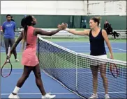  ?? Doug Walker, City of Rome ?? Tatjana Maria of Germany (right) is congratula­ted on her win by opponent Alycia Parks of the U.S. at the Georgia’s Rome Tennis Open on Feb. 6. Maria beat Parks 6-4, 4-6, 6-2.