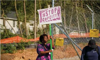  ?? ?? Protesters against the Cop City training site in Atlanta. Photograph: Megan Varner/Reuters