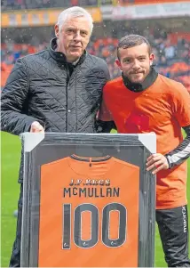  ?? Picture: SNS. ?? David Narey presents Paul Mcmullan with a special jersey to mark the milestone.