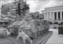  ?? [JACQUELYN MARTIN/THE ASSOCIATED PRESS] ?? A soldier hops out of a Bradley Fighting Vehicle after moving it into place by the Lincoln Memorial for tonight’s “Salute to America.”