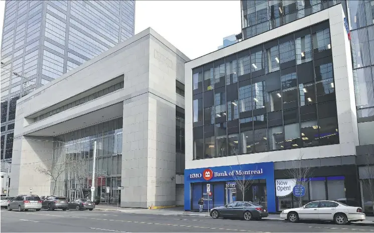  ?? ED KAISER ?? The old BMO building, left, is now vacant and may be demolished. The BMO main branch is now in the Enbridge Building next door at 10185 101 St.