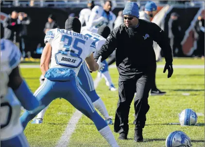  ?? ASSOCIATED PRESS PHOTO/CHARLES REX ARBOGAST ?? Detroit Lions head coach Jim Caldwell greets his players before an NFL football game against the Bears Sunday in Chicago. The Lions host the Vikings in one of three Thanksgivi­ng Day games today, but Caldwell refuses to describe the North Division...