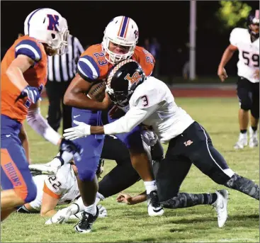  ??  ?? LaFayette’s KaDarrin Ramsey delivers a hit on Northwest running back Dominique Sistrunk during the first half of Friday’s game in Tunnel Hill. (Dalton Daily Citizen photo/Matt Hamilton)