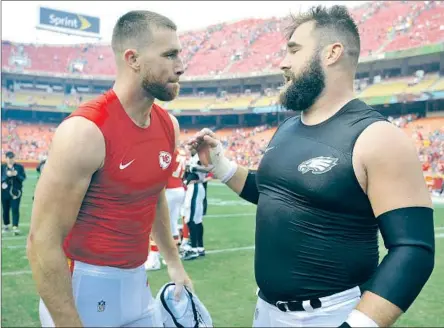  ?? Ed Zurga Associated Press ?? Travis Kelce, left, talks to his older brother, Eagles center Jason Kelce, after Kansas City’s 27-20 win Sept. 17, 2017.