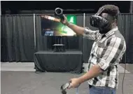  ?? MARCO SANTANA/STAFF ?? UCF student Hezekiah Olopade is seeking funding to further develop the virtual reality game he and his team of five built.