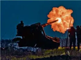  ?? AP PHOTO/LIBKOS ?? Ukrainian soldiers fired a Pion artillery system at Russian positions in the Donetsk region of eastern Ukraine.