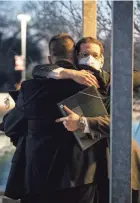  ?? ASSOCIATED PRESS ?? Congregati­on Beth Israel Rabbi Charlie Cytron-Walker, facing camera, hugs a man after a healing service Jan. 17 at White’s Chapel United Methodist Church in Southlake, Texas. Cytron-Walker was one of four people held hostage by a gunman at his Colleyvill­e, Texas, synagogue.