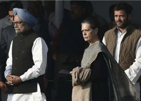  ?? ADNAN ABIDI/REUTERS ?? Indian Prime Minister Manmohan Singh, left, with Sonia Gandhi, Chief of India’s ruling Congress party, and her son, lawmaker Rahul Gandhi.