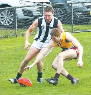  ??  ?? Young Drouin player Liam Anderson, still eligible for the Under 18s, beats his Sale opponent to the ball as the side’s battled it out in the senior game at Drouin on Saturday, Sale’s win giving it hope of playing finals.