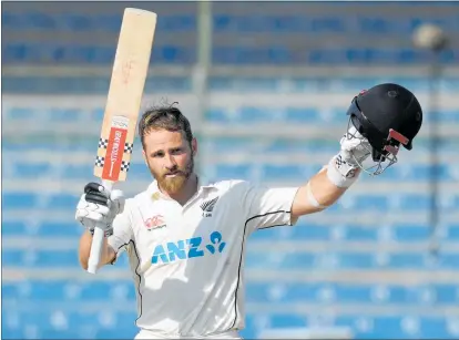  ?? PHOTO / AP ?? Kane Williamson raises his bat after reaching 200 for the fifth time in test cricket, a Black Caps record.