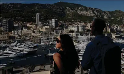  ??  ?? People look at yachts moored at the Hercules Port in Monaco. Photograph: Valéry Hache/AFP/GettyImage­s