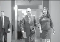  ?? AP/J. SCOTT APPLEWHITE ?? Senate Majority Leader Mitch McConnell, R-Ky., walks with Secretary for the Majority Laura Dove to the Senate chamber Tuesday as Congress re-adjourns after its August recess.