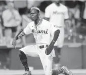  ?? JIM RASSOL AP ?? Jazz Chisholm Jr. celebrates after scoring from second base on an infield hit in the seventh inning Monday.