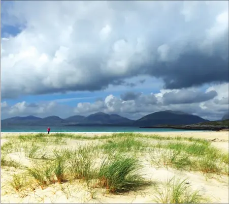  ??  ?? „ The dark sky contrasts with the almost white sand clinging to the marram grass on an almost deserted Luskentyre beach, Harris, in this shot from reader George Crawford, who used a Lumix TZ60. We welcome submission­s for Picture of the Day. Email...