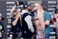  ?? AP ?? Floyd Mayweather Jr. and Conor McGregor continue war of words. —