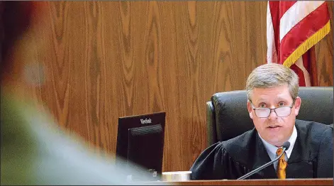  ?? ?? Catawba County District Court Judge David W. Aycock (right) addresses a veteran Oct. 28 during a Veterans Court session.