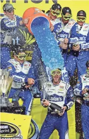  ?? JOHN DAVID MERCER, USA TODAY SPORTS ?? Jimmie Johnson gets a Gatorade bath after winning his seventh Cup title, matching Richard Petty and Dale Earnhardt Sr.