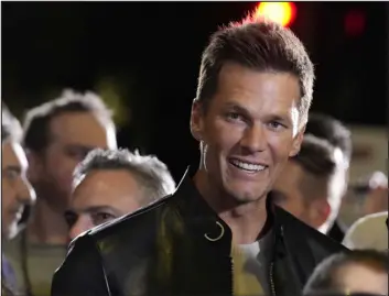  ?? CHRIS PIZZELLO — THE ASSOCIATED PRESS ?? Tom Brady, a cast member and producer of “80 for Brady,” looks down the carpet at the premiere of the film Tuesday at the Regency Village Theatre in Los Angeles.