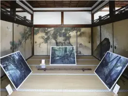  ?? ?? Above: Photos by Hisao Taira are exhibited in the White Shoin room in Ninnaji temple’s Goten palace in Kyoto, as part of KG+ exhibition­s. The work is titled “Land of prayer nature worship.”