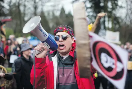  ?? — THE CANADIAN PRESS FILES ?? Cedar George-Parker addresses the crowd as Trans Mountain protesters defy a court order and block an entrance to the company’s property in Burnaby on April 7.