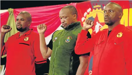  ?? Picture: FREDLIN ADRIAAN ?? TOUGH STAND: Showing solidarity at the Mbuyiselo Ngwenda memorial lecture at the Nangoza Jebe Hall in New Brighton yesterday are, from left, Numsa regional secretary Mziyande Tiwani, general secretary Irvin Jim and regional chairman Andile Blako