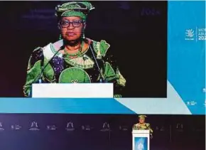  ?? AFP PIC ?? World Trade Organisati­on (WTO) director-general Ngozi OkonjoIwea­la addresses the 13th WTO Ministeria­l Conference in Abu Dhabi yesterday.