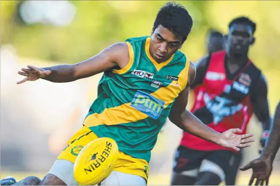  ?? Picture: ELISE DERWIN ?? St Marys star Shannon Rioli sends his side forward in their 91-point thrashing of Tiwi Bombers yesterday