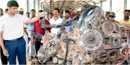  ?? — DC ?? Madurai corporatio­n commission­er Sandeep Nanduri examines a jallikattu bull made from steel and metal scrap found in the corporatio­n dumping yard, in Madurai on Tuesday.