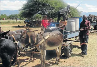  ?? PHOTOS: TUMO MOKONE ?? WATER BLUES: Lucas Papole of Mongalo village uses his donkey cart, and help from a couple of little hands, to fetch water for residents at a fee. Though he earns some income for his business, he complained bitterly over the scarcity of water in GaMalebogo