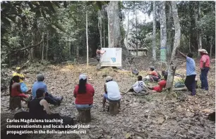  ??  ?? Carlos Magdalena teaching conservati­onists and locals about plant propagatio­n in the Bolivian rainforest