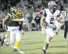  ?? Nikolas Samuels /The Signal ?? Saugus quarterbac­k Elijah Gragas (2) drives the ball up the field as Canyon’s Richard Bueno (6) and Chris Borella (56) chase him.