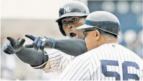  ?? Getty Images; Paul J. Bereswill ?? IT’S A HIT: Yankees like Didi Gregorius back in April (above) share the love after hits, apparently at Gary Sanchez’s urging (left).