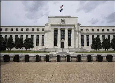  ?? PATRICK SEMANSKY — THE ASSOCIATED PRESS FILE ?? Americans' financial health reached its highest level in nearly a decade last year, the Federal Reserve, shown above, said Monday, spurred by a strong job market and government support payments.