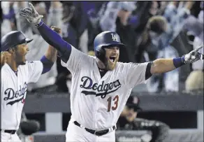  ?? Mark J. Terrill The Associated Press ?? Dodgers infielder Max Muncy rounds the bases after his home run in the 18th inning gave Los Angeles a 3-2 home victory against the Red Sox in Game 3 of the World Series early Saturday.
