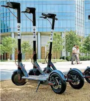  ?? [PHOTO BY JIM BECKEL, THE OKLAHOMAN] ?? Bird motorized scooters parked on Sheridan Avenue in front of the Devon Tower and Myriad Gardens last month. Officials with Lime and Bird scooter companies told the Oklahoma City Council on Tuesday that the number of scooters being allowed is too low.