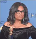  ?? JORDAN STRAUSS/INVISION ?? Oprah Winfrey poses at the Golden Globe Awards.