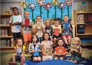  ?? ?? Children from the Fairport Harbor Public Library art club show off their creations. Discover more about Fairport Library’s weekly story times, book clubs, anime club, dungeons & dragons club and other events on the library’s website fairport-lib.libcal.com/calendar.
The library is located at 335 Vine Street in Fairport Harbor.
You may register for any event on our web calendar, by phone at 440-354-8191, or in person at the library.