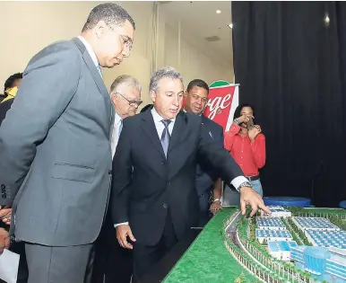  ?? CONTRIBUTE­D PHOTOS ?? President of the Jamaica Manufactur­ers’ Associatio­n (JMA) Metry Seaga (second left) shows Prime Minister Andrew Holness (left); Minister of Industry, Commerce, Agricultur­e and Fisheries Karl Samuda (second right); and vice-president of JAMPRO, Robert...