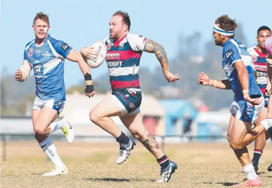  ?? Picture: RICHARD GOSLING ?? Runaway Bay centre Jamie Anderson on his way to scoring a try against Tugun.