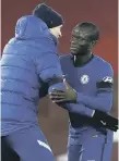  ??  ?? Chelsea manager Thomas Tuchel embraces N’Golo Kante.