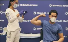  ?? AFP ?? Dr Nadav Fields reacts after receiving the Moderna Covid-19 vaccine at Broward Health Imperial Point, Florida