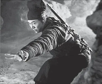  ??  ?? With stunning stunts and martial-arts action, Jet Li teams with famed Hong Kong director Tsui Hark to hunt treasure in the must-see IMAX 3-D version of “Flying Swords of Dragon Gate.”