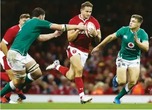  ??  ?? Money-spinner: Wales full-back Hallam Amos makes a break against Ireland