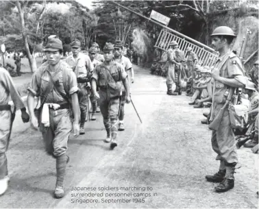  ??  ?? Japanese soldiers marching to surrendere­d personnel camps in Singapore, September 1945